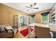 Spacious office featuring a built-in bookcase, hardwood floors, and a comfortable seating area at 360 Glade Knoll Trail Trl, Fayetteville, GA 30215