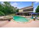 Beautiful backyard pool and spa with lush landscaping, creating a private oasis at 360 Glade Knoll Trail Trl, Fayetteville, GA 30215