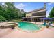 Backyard pool featuring a built-in hot tub and a tanning ledge, perfect for relaxation and entertaining at 360 Glade Knoll Trail Trl, Fayetteville, GA 30215