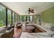 Bright and airy sunroom with comfortable seating and views of the lush backyard at 360 Glade Knoll Trail Trl, Fayetteville, GA 30215