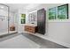 Bright bathroom with a glass shower, vessel sink, and views of the surrounding greenery at 545 Matterhorn Way Way, Alpharetta, GA 30022