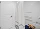 Clean bathroom with white shower curtain, white door and linen storage at 545 Matterhorn Way Way, Alpharetta, GA 30022