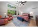 Light-filled bedroom with high ceilings, large windows, seating area, and stylish decor at 545 Matterhorn Way Way, Alpharetta, GA 30022