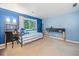 Bedroom features blue walls, window, daybed, desk and natural light at 545 Matterhorn Way Way, Alpharetta, GA 30022
