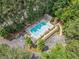 Aerial view of the community pool, surrounded by trees, parking, and lounge chairs at 545 Matterhorn Way Way, Alpharetta, GA 30022