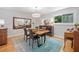 Elegant dining room featuring a modern light fixture and an attractive accent mirror at 545 Matterhorn Way Way, Alpharetta, GA 30022