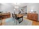 Dining room showcasing hardwood floors, an elegant light fixture, and a view to the living spaces at 545 Matterhorn Way Way, Alpharetta, GA 30022