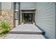 Beautiful tiled front entrance with double doors, dark trim and stone accents at 545 Matterhorn Way Way, Alpharetta, GA 30022