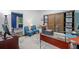 Office space features shiplap wall, stylish wood barn doors, desk and sitting area at 545 Matterhorn Way Way, Alpharetta, GA 30022