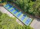 Aerial view of multiple well-maintained tennis courts with parking and lush green surroundings at 545 Matterhorn Way Way, Alpharetta, GA 30022
