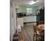 Cozy kitchen features white cabinets, countertop space, and an eat-in dining area at 6305 Eidson Dr, Cumming, GA 30041