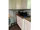Kitchen features white cabinets and laminate countertops, offering a clean and functional space at 6305 Eidson Dr, Cumming, GA 30041