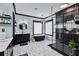 Modern bathroom featuring a black freestanding tub, patterned tile floors, and sleek black vanity at 1186 Lincoln Dr, Marietta, GA 30066