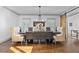 Dining room with a large wooden table, decorative chairs, and a modern chandelier at 1186 Lincoln Dr, Marietta, GA 30066