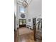 Grand foyer with high ceilings, hardwood floors, and a striking decorative wall clock at 1186 Lincoln Dr, Marietta, GA 30066