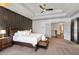 A main bedroom features a black accent wall, barn doors, tray ceilings, and a seating area at 1186 Lincoln Dr, Marietta, GA 30066