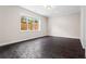 Basement with wood-look tile and natural light streaming from a window at 2493 Oostanaula Ne Dr, Brookhaven, GA 30319