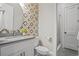 Stylish bathroom features a modern vanity, designer tile, and a glass-enclosed shower at 2493 Oostanaula Ne Dr, Brookhaven, GA 30319