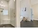 Well-lit bathroom displaying a glass shower and herringbone floors at 2493 Oostanaula Ne Dr, Brookhaven, GA 30319