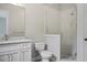 Bright bathroom featuring white vanity, a glass enclosed shower, and neutral walls at 2493 Oostanaula Ne Dr, Brookhaven, GA 30319