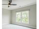 Comfortable bedroom with a ceiling fan and bright windows at 2493 Oostanaula Ne Dr, Brookhaven, GA 30319
