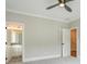 Bedroom featuring neutral walls, ceiling fan, and an adjoining bathroom at 2493 Oostanaula Ne Dr, Brookhaven, GA 30319
