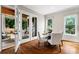 Bright dining room with natural light, leading to a covered porch through French doors at 2493 Oostanaula Ne Dr, Brookhaven, GA 30319