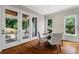 Bright dining room with natural light, leading to a covered porch through French doors at 2493 Oostanaula Ne Dr, Brookhaven, GA 30319