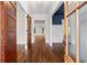 Inviting foyer showcases gleaming hardwood floors and a glimpse into other rooms at 2493 Oostanaula Ne Dr, Brookhaven, GA 30319