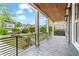 Spacious front porch with beautiful tile flooring, columns and a black metal railing at 2493 Oostanaula Ne Dr, Brookhaven, GA 30319