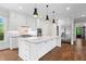 Well-appointed kitchen features an island with marble countertop, stainless steel appliances and fixtures at 2493 Oostanaula Ne Dr, Brookhaven, GA 30319