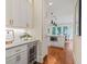 Convenient butler's pantry features custom cabinets and a built-in wine refrigerator at 2493 Oostanaula Ne Dr, Brookhaven, GA 30319
