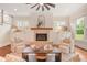 Bright living room boasts a stylish fireplace, large windows, and comfortable seating at 2493 Oostanaula Ne Dr, Brookhaven, GA 30319