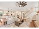 Open-concept living room showcases the kitchen, staircase and a neutral color palette at 2493 Oostanaula Ne Dr, Brookhaven, GA 30319