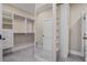 Custom walk-in closet featuring built-in shelving and mirrors for organization at 2493 Oostanaula Ne Dr, Brookhaven, GA 30319