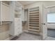 Spacious walk-in closet offering ample shelving and storage solutions at 2493 Oostanaula Ne Dr, Brookhaven, GA 30319