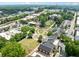 An aerial view shows the charming downtown area with manicured green spaces at 3190 Crestview Circle Nw Cir, Duluth, GA 30096