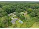 An aerial view showing the neighborhood and the homes private backyard pool at 3190 Crestview Circle Nw Cir, Duluth, GA 30096