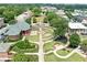 Aerial view showcasing a beautifully landscaped town square with a fountain and well-manicured lawns at 3190 Crestview Circle Nw Cir, Duluth, GA 30096