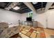 Finished basement area with a comfortable seating arrangement and adjacent workspace at 3190 Crestview Circle Nw Cir, Duluth, GA 30096