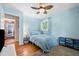 Comfortable bedroom featuring hardwood floors and a ceiling fan at 3190 Crestview Circle Nw Cir, Duluth, GA 30096