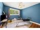 Bedroom offering hardwood floors and ample sunlight streaming through a large window at 3190 Crestview Circle Nw Cir, Duluth, GA 30096
