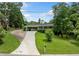 A delightful home with a carport, a well-manicured lawn, and a long driveway at 3190 Crestview Circle Nw Cir, Duluth, GA 30096
