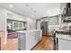 Modern kitchen featuring a center island with granite countertops and stainless steel appliances at 3190 Crestview Circle Nw Cir, Duluth, GA 30096