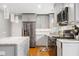 Contemporary kitchen with stainless steel appliances, granite countertops, and pendant lighting at 3190 Crestview Circle Nw Cir, Duluth, GA 30096