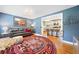 Well-lit living room open to the kitchen features hardwood floors and modern decor at 3190 Crestview Circle Nw Cir, Duluth, GA 30096