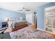 Cozy main bedroom with ensuite bath, ceiling fan and hardwood floors at 3190 Crestview Circle Nw Cir, Duluth, GA 30096