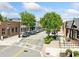 Charming street view featuring shops, sidewalks, street parking, and greenery on a sunny day at 3190 Crestview Circle Nw Cir, Duluth, GA 30096