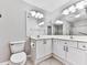 Bright bathroom featuring double sinks, neutral paint, and a large, mirrored backsplash at 3334 Peachtree Ne Rd # 614, Atlanta, GA 30326