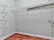 Walk-in closet featuring metal shelving and wooden floors at 3334 Peachtree Ne Rd # 614, Atlanta, GA 30326